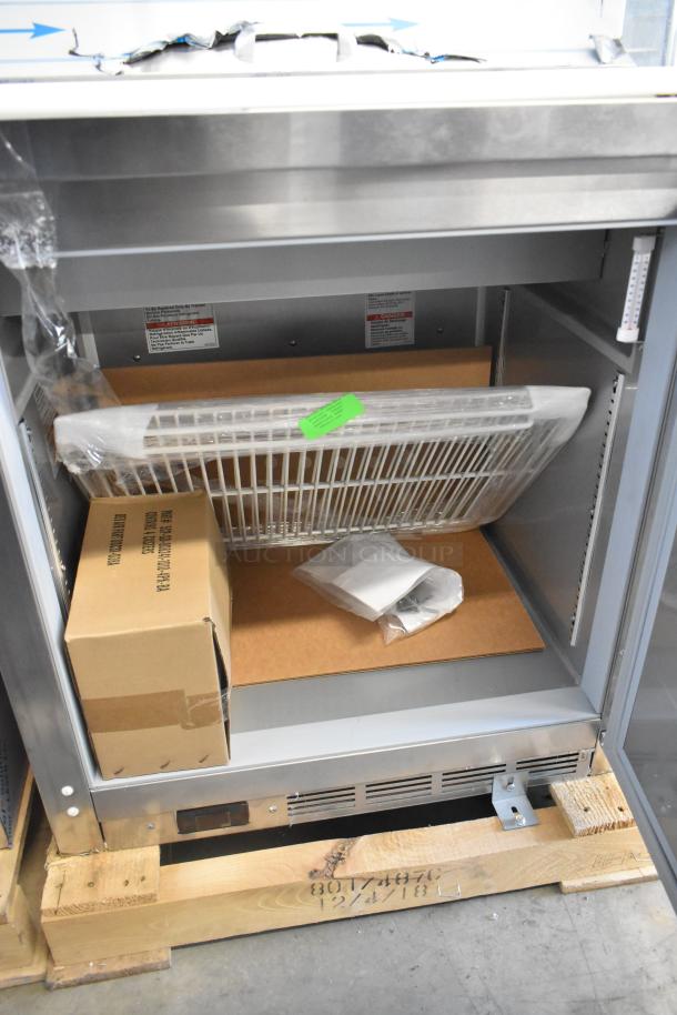 Beverage Air SPE27HC-B stainless steel prep table, brand new, scratch and dent. Includes packing materials and label details.