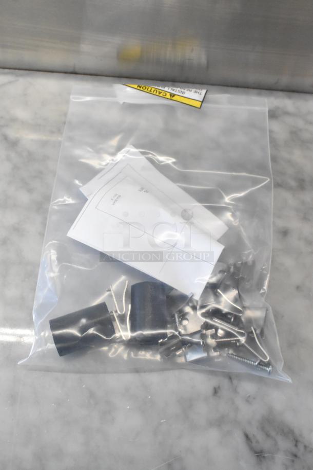 Bag with hardware and installation instructions for Beverage Air UCR48AHC-23 2 Door Undercounter Cooler, caution label visible.