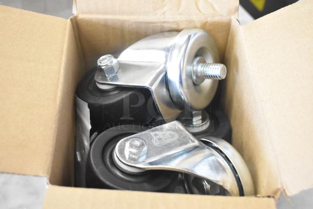 Casters for Beverage Air UCR48AHC-23 cooler in open box, new condition. Silver metal and black wheels visible.