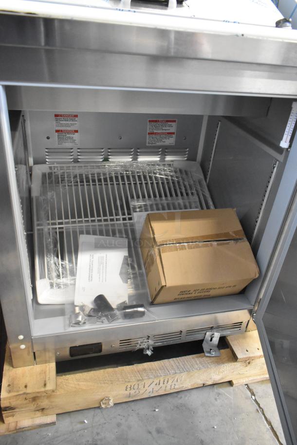 BRAND NEW SCRATCH AND DENT! Beverage Air SPE27HC-B stainless steel sandwich salad prep table with packaging, 115V, 1 phase.