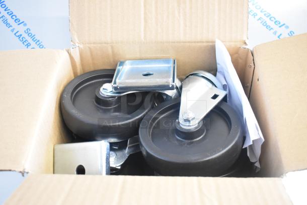 Box of caster wheels and metal brackets for a Beverage Air SPE27HC-B sandwich prep table.