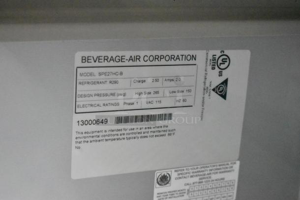 Beverage Air SPE27HC-B label indicating model, refrigerant, design pressure, and electrical ratings. 115 volts, 1 phase.