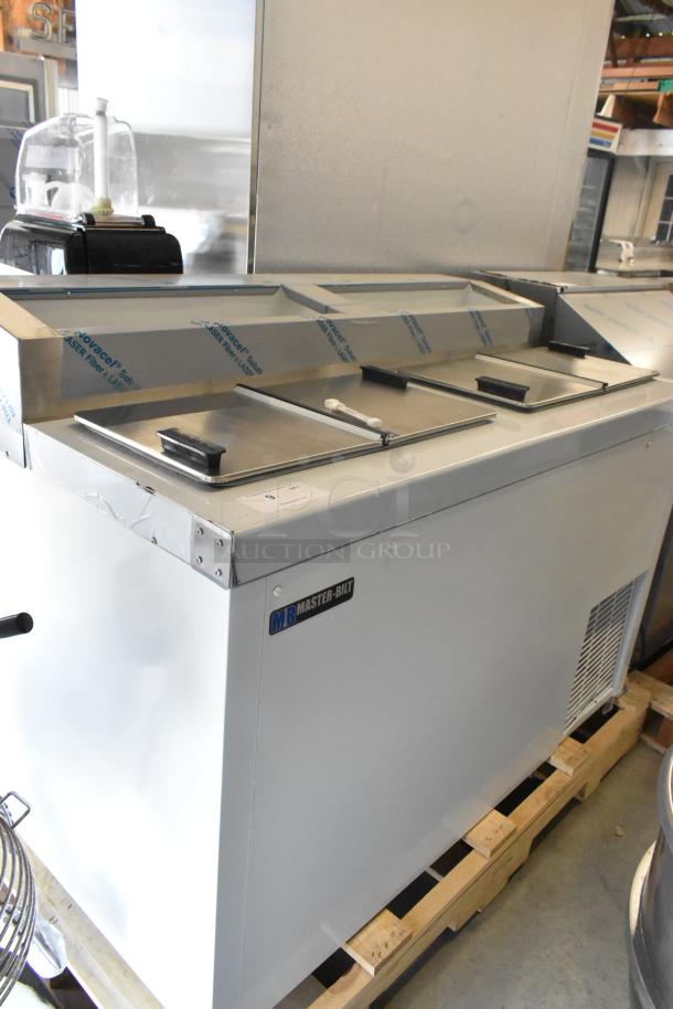 Brand new Master-Bilt FLR-80 ice cream topping unit with refrigerated base, 54", model nameplate visible, slight dent.