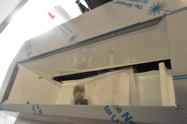 Brand new Master-Bilt FLR-80 ice cream topping unit, 54", with refrigerated base, 115 volts, 1 phase; minor scratches.