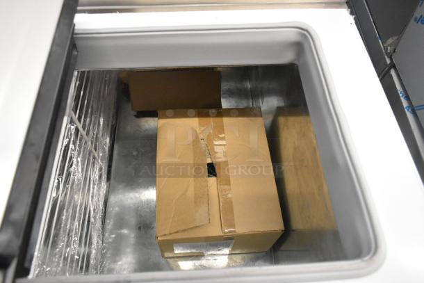 Brand new Master-Bilt FLR-80 metal ice cream topping unit, 54" with refrigerated base. Some scratches and dents present. 115V, 1 phase.