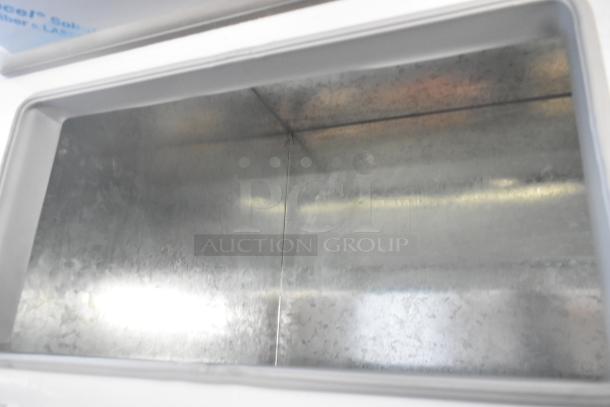 BRAND NEW Master-Bilt FLR-80 metal commercial 54" ice cream topping unit with refrigerated base. Minor scratches visible.