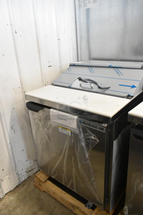 Brand new Beverage Air SPE27HC-B stainless steel prep table, scratches/dents noted. 115V, 1-phase. Protective wrap visible.