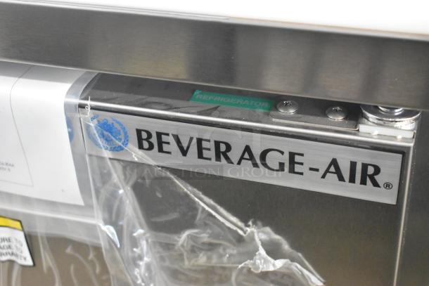Brand new Beverage Air SPE27HC-B stainless steel sandwich prep table, 115V, visible labels, minor scratches.