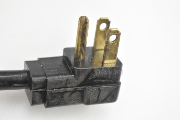 A close-up of a black plug for the Beverage Air SPE27HC-B sandwich salad prep table.