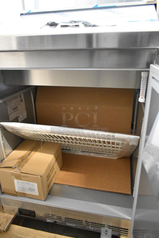 Beverage Air SPE27HC-B stainless steel prep table, scratch and dent condition. Includes interior packing materials. 115V, 1 Phase.