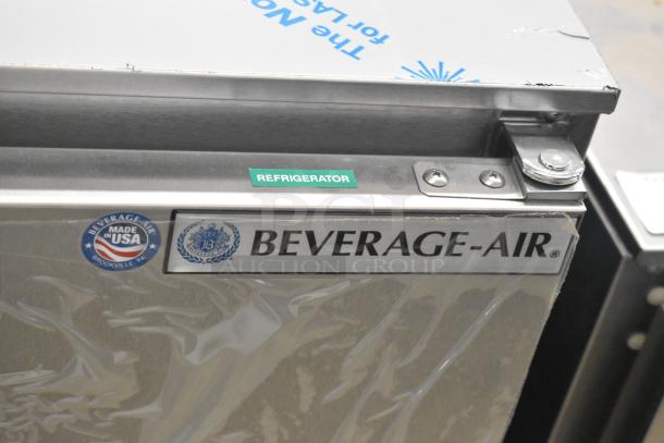 Beverage Air UCR48AHC-23 stainless steel cooler, dual doors, "Made in USA" and "Refrigerator" labels, new with dents.
