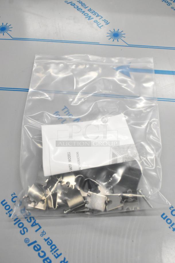 Plastic bag containing metal components and a folded instruction manual for Beverage Air UCR48AHC-23 cooler.