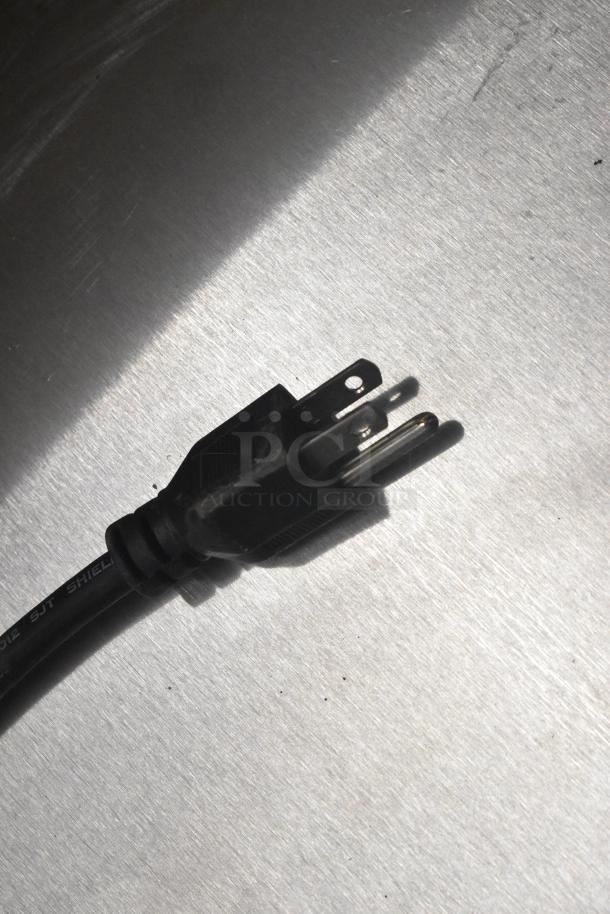 Stainless steel surface with a power cord on a Beverage Air UCR48AHC-23 cooler, 115 volts, 1 phase. Brand new with minor scratches.