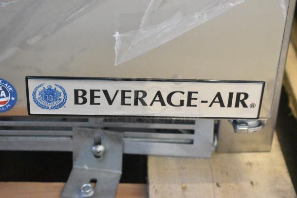 BRAND NEW Beverage Air SPE27HC-12M stainless steel prep table; minor scratches, 115V, 1 phase; logo visible.