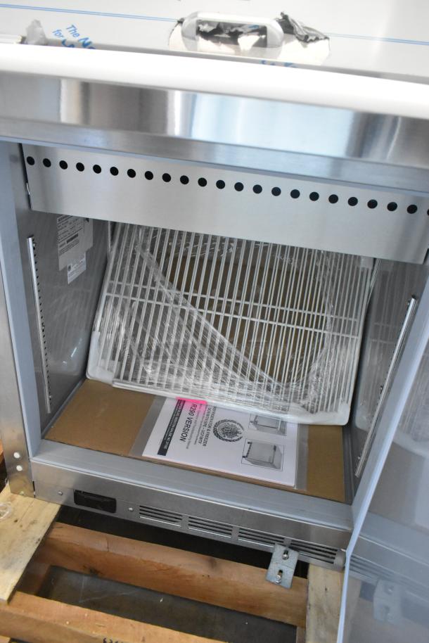 Beverage Air SPE27HC-12M stainless steel prep table, new scratch and dent, with manual and wrapped shelving. 115V, 1 Phase.