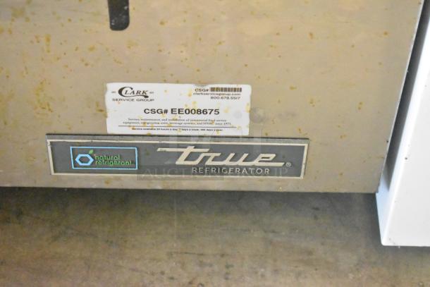 True TUC-27D-2-HC stainless steel undercounter cooler, scratch and dent, with service label. 115V, 1 Phase.