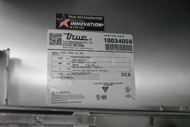 True TUC-27D-2-HC undercounter cooler tag showing model details, 115 volts, and refrigerant info. Made in the USA.