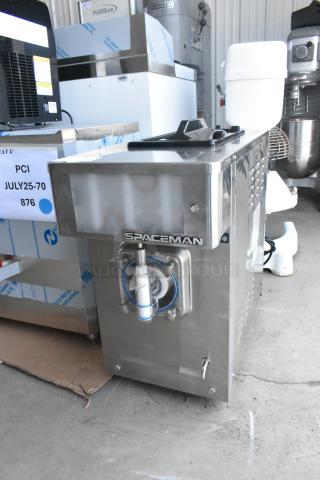 Spaceman 6450-CL frozen beverage machine, stainless steel, single flavor, 110V, new condition, slight scratches visible.