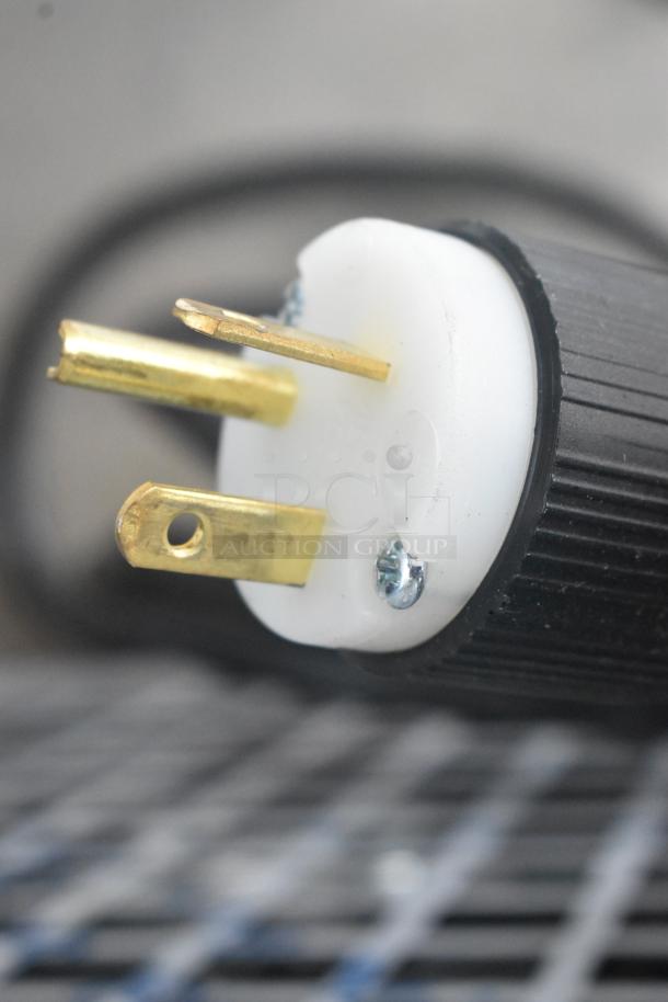 Close-up of a power plug for a Spaceman 6450-CL stainless steel commercial frozen beverage machine, 110 volts, 1 phase.