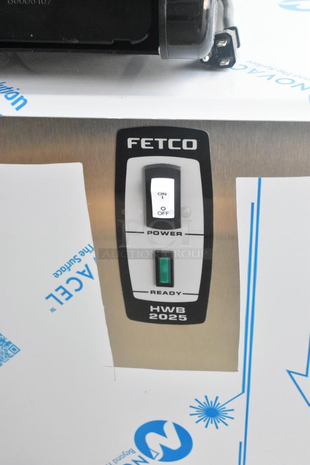 BRAND NEW 2024 Fetco HWB-25 25 Gallon Stainless Steel Hot Water Dispenser; 120/208-240 Volts, 3 Phase. On/off switch visible.