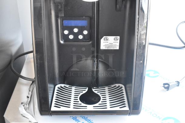 Brand new single hopper slushie machine with metal exterior, minor scratches. ETL listed. Digital control panel visible.