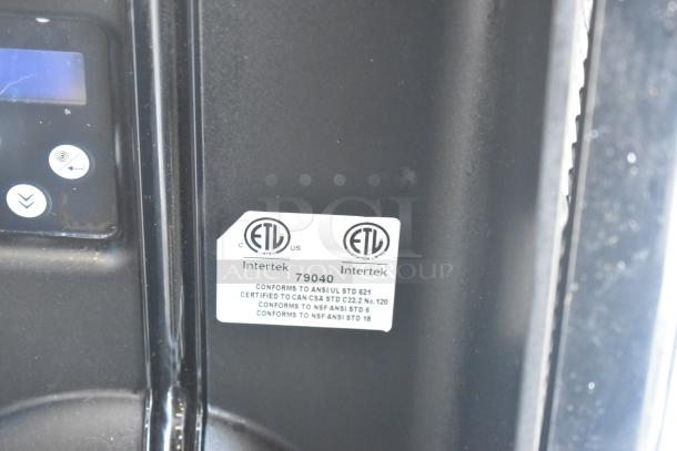 "ETL certified label on metal commercial countertop slushie machine, model 79040, indicating certification to ANSI and CSA standards."