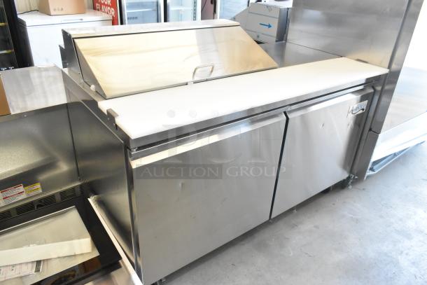 Brand new 2023 Avantco 178SSPT6010 stainless steel sandwich prep table with slight dents, 2 doors, workstation, casters.