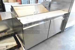 Brand new 2023 Avantco 178SSPT6010 stainless steel sandwich prep table with slight dents, 2 doors, workstation, casters.