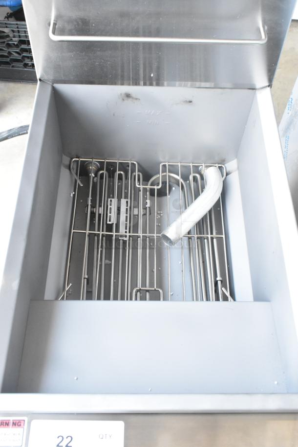 Avantco 177EF40B stainless steel electric deep fryer, internal view showing heating elements and metal fry baskets, unused condition.