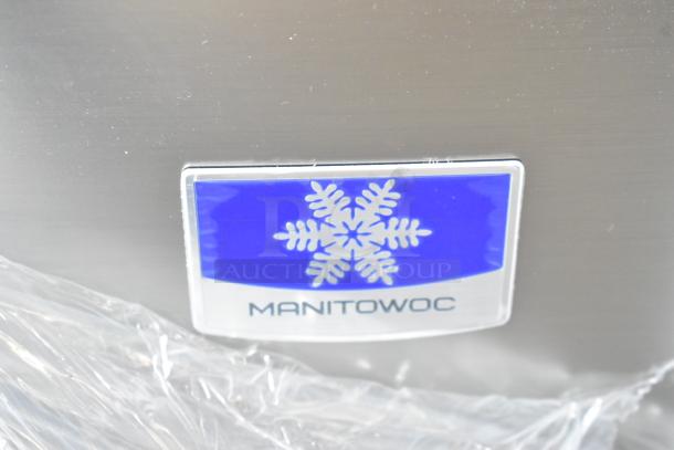 Stainless steel Manitowoc ice machine with brand logo. Model UDF0240A-161B, new scratch and dent, 90 lb. bin capacity.