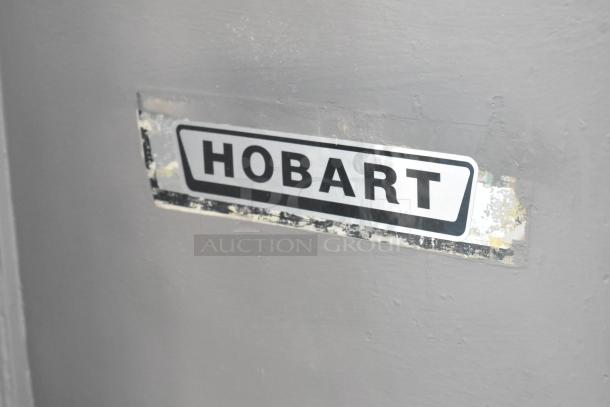 Hobart M-802 commercial 80-quart dough mixer with mixing bowl and dough hook. Metal body, 440 volts, 3 phase. Visible Hobart label.