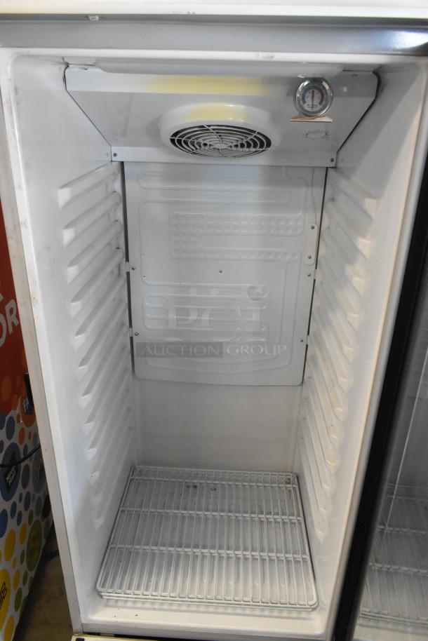 Premium PRF90DX Metal Single Door Reach-In Cooler Merchandiser, 115V, 1 Phase. Interior view, shelves and fan.