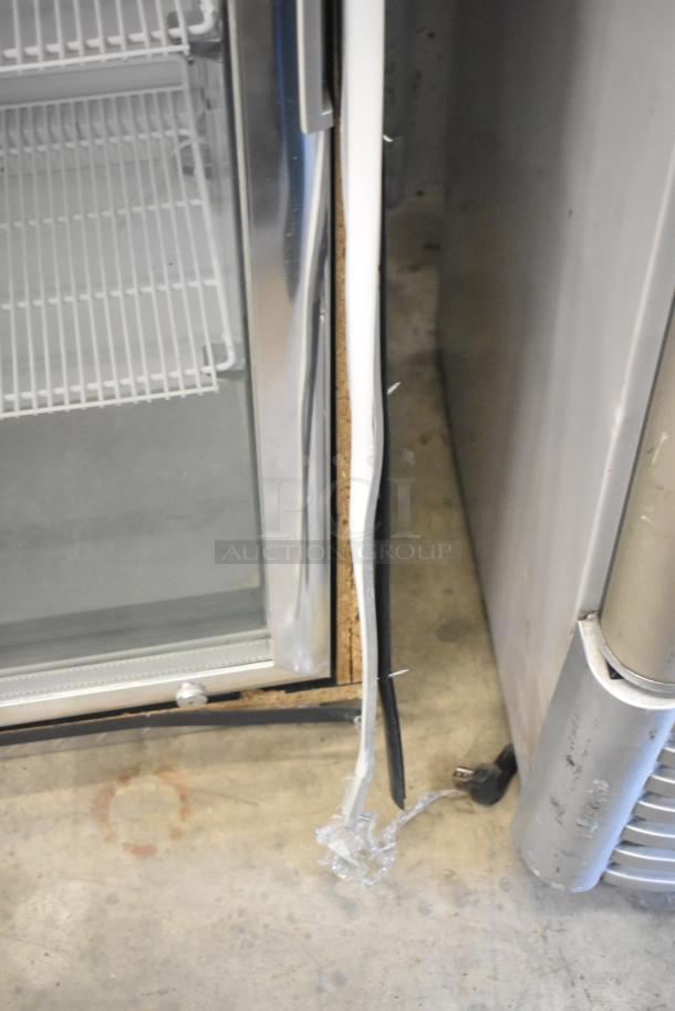 IDW G4-H0234B metal two-door cooler with poly-coated racks, visible edge damage. Runs on 115 volts, 1 phase.