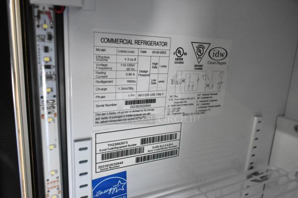 2021 IDW G4-H0234B 2-door commercial cooler, poly-coated racks, 115V, 1 phase, with detailed model labels visible.