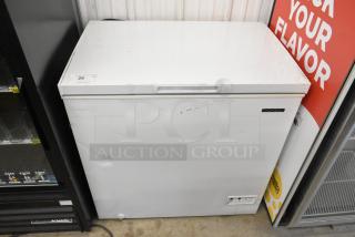 Thomson TFRF710-G-SM chest freezer, white, showing minor scratches and dents. 115 volts, 1 phase. Auction label present.