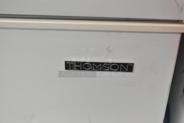Thomson TFRF710-G-SM chest freezer, 115 volts, 1 phase. Visible Thomson logo on a clean white surface.