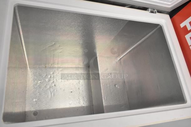 Thomson TFRF710-G-SM chest freezer, open and empty, 115V, 1-phase, sturdy interior. Ideal for bulk storage.