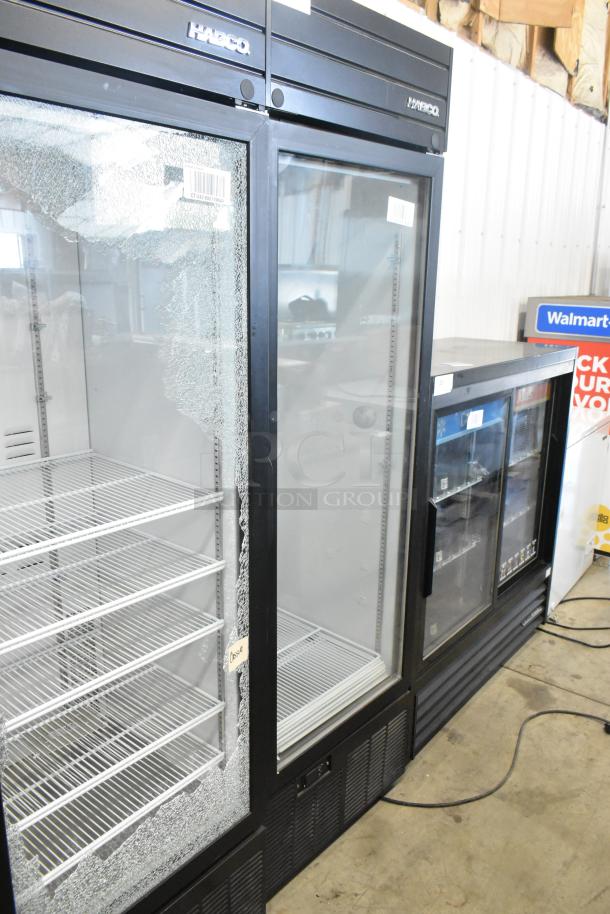 2019 Habco SE18 metal commercial single-door cooler with poly-coated racks, visible glass damage, 115V, 1 phase.