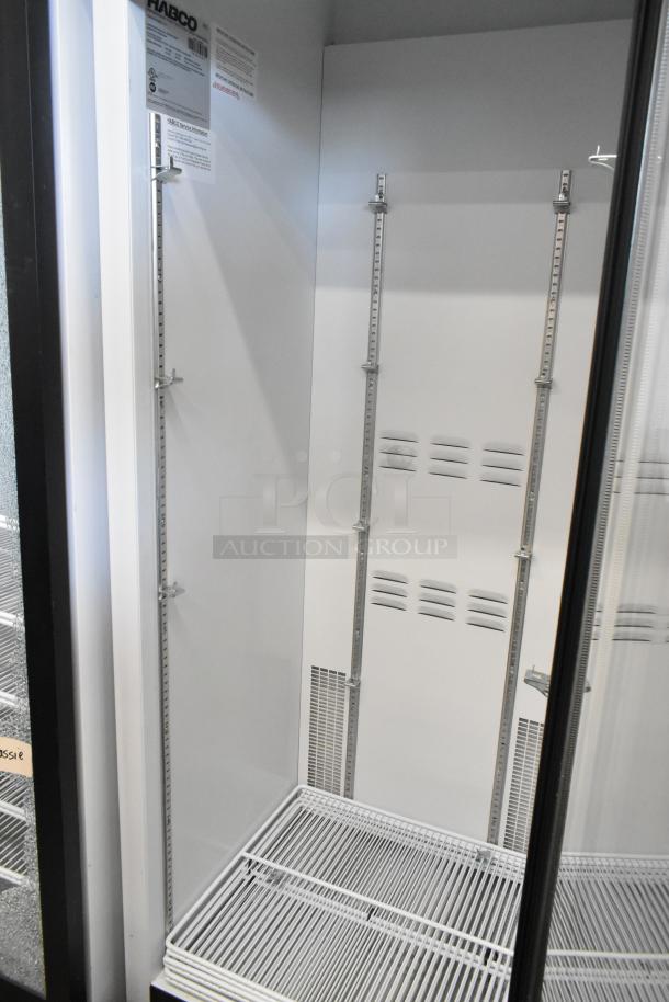 2019 Habco SE18 commercial reach-in cooler, single door, metal, poly-coated racks, 115V, 1 phase, visible interior condition.