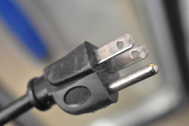 Close-up of a power plug for the 2023 IDW G-4SI-N-2-3-4-B-5 commercial cooler, 115 volts, 1 phase.