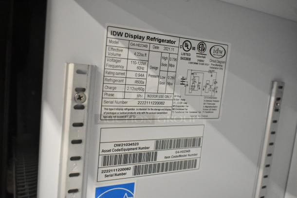 2023 IDW G-4SI-N-2-3-4-B-5 Metal 2 Door Cooler w/Poly Coated Racks. 115V, 1 Phase. Tags show model and serial numbers.