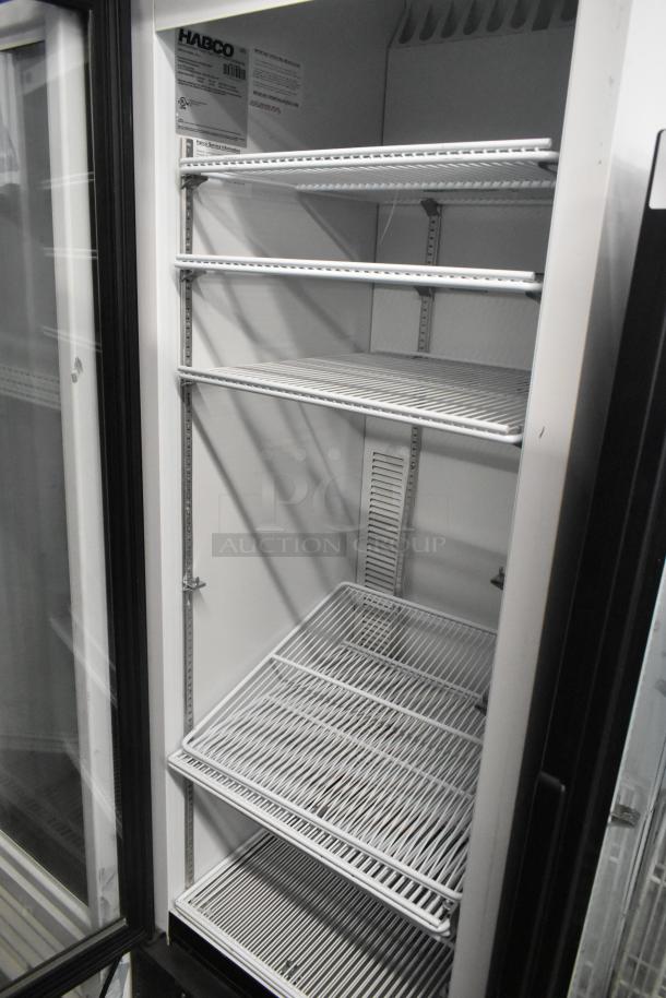 2019 Habco SE18 commercial cooler, single door, metal, with poly-coated racks. Model label visible inside. Excellent condition.