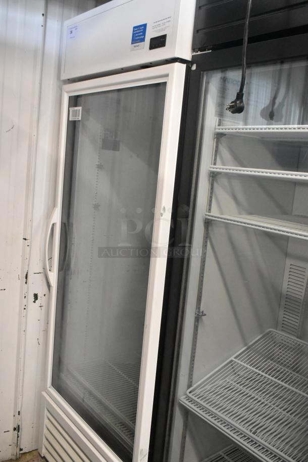2021 True TSCI-600R-G-PH commercial cooler with glass door, poly coated racks, and 115V 1 phase. Appears in good condition.