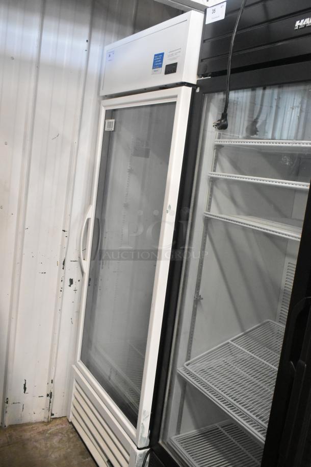 2021 True TSCI-600R-G-PH commercial single door cooler, white, with poly coated racks, 115 volts, 1 phase.