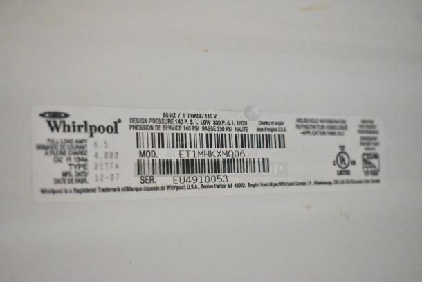 Whirlpool ET1MHKXMQ06 cooler with freezer, metal, 115V, 1 Phase. Label shows model and serial number.
