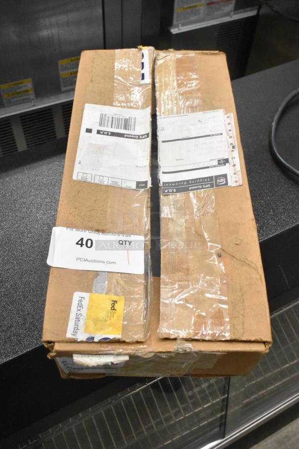 Lot of 2 brand new scratch and dent metal panels in unopened shipping box. Visible shipping labels and auction sticker.