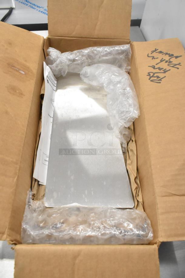 Lot of 2 brand new metal panels in original packaging, displaying minor scratches and dents, with bubble wrap and box labels visible.