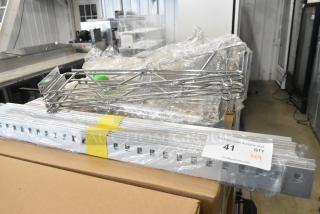 Lot of 9 brand new chrome finish shelf brackets, various items. Includes original packaging. Marked "41 QTY VX9".