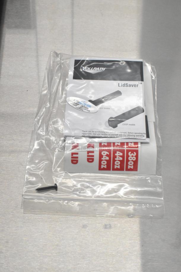 Vollrath LidSaver™ 3 in-counter dispenser, new, fits 3 1/4"-3 3/4" lids, includes labels and instructions.