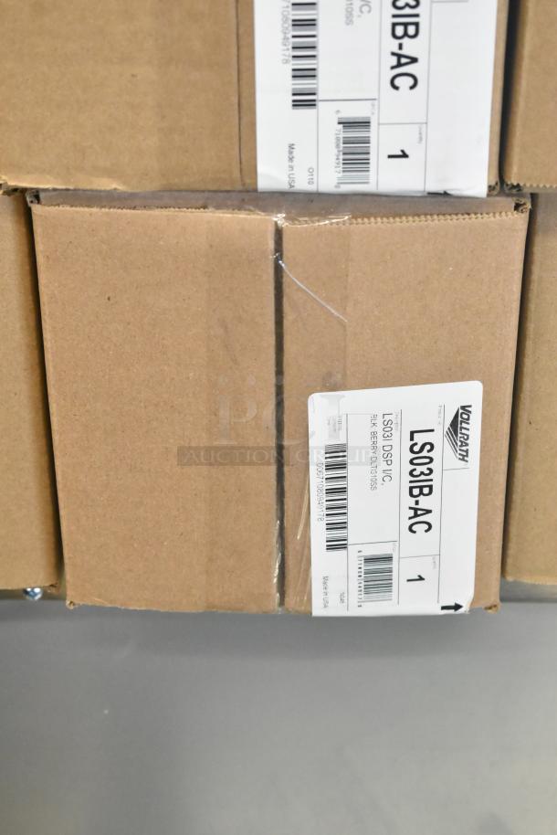 4 new Vollrath LS03IB-AC LidSaver™ 3 lid dispensers in boxes. Visible labels show model and barcode.